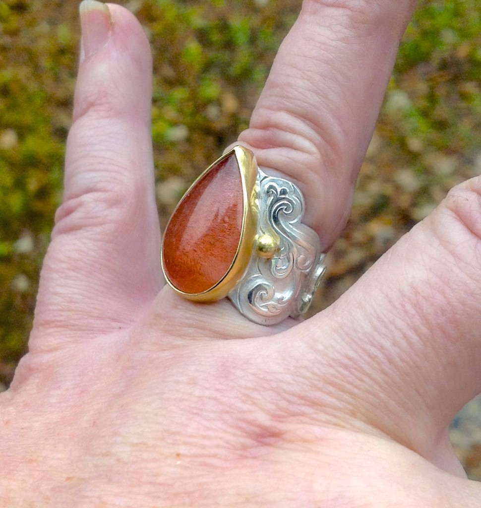 Photo By 18k gold and sterling scrollwork overlay ring made with a rare strawberry quartz crystal mined high in the remote central Asian mountains of Kazakhstan.